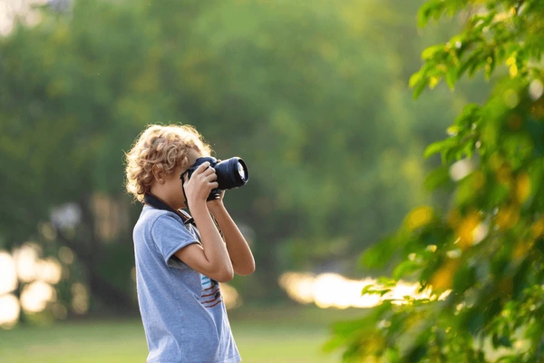 kid taking photo