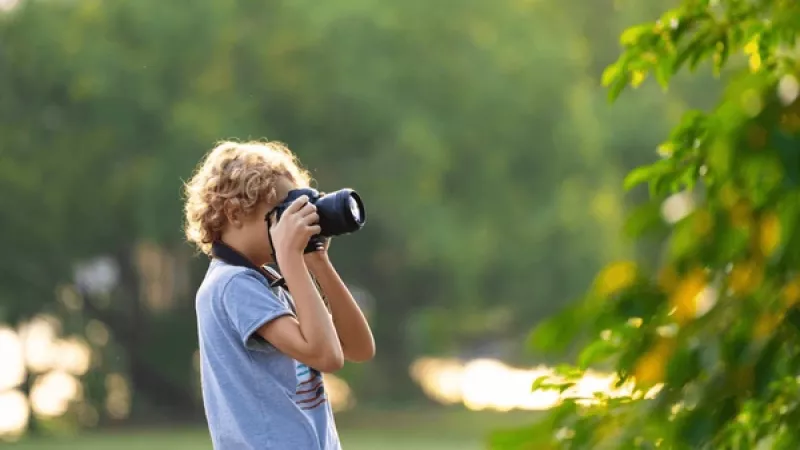 kid taking photo